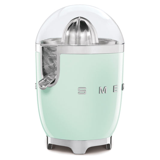 Exprimidor SMEG verde menta con diseño retro, ideal para preparar jugos frescos