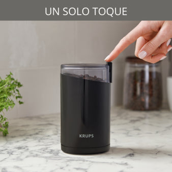 Molino de café eléctrico IMUSA en color negro con diseño moderno y botón de un solo toque