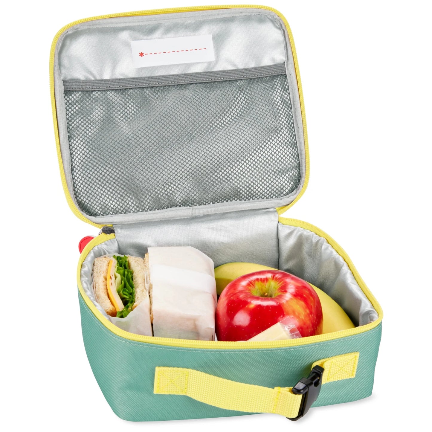 Lonchera infantil verde abierta con sándwich, manzana y plátano en su interior