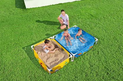 piscina infantil con tubos Bestway, vista lateral, niños jugando en arena y agua
