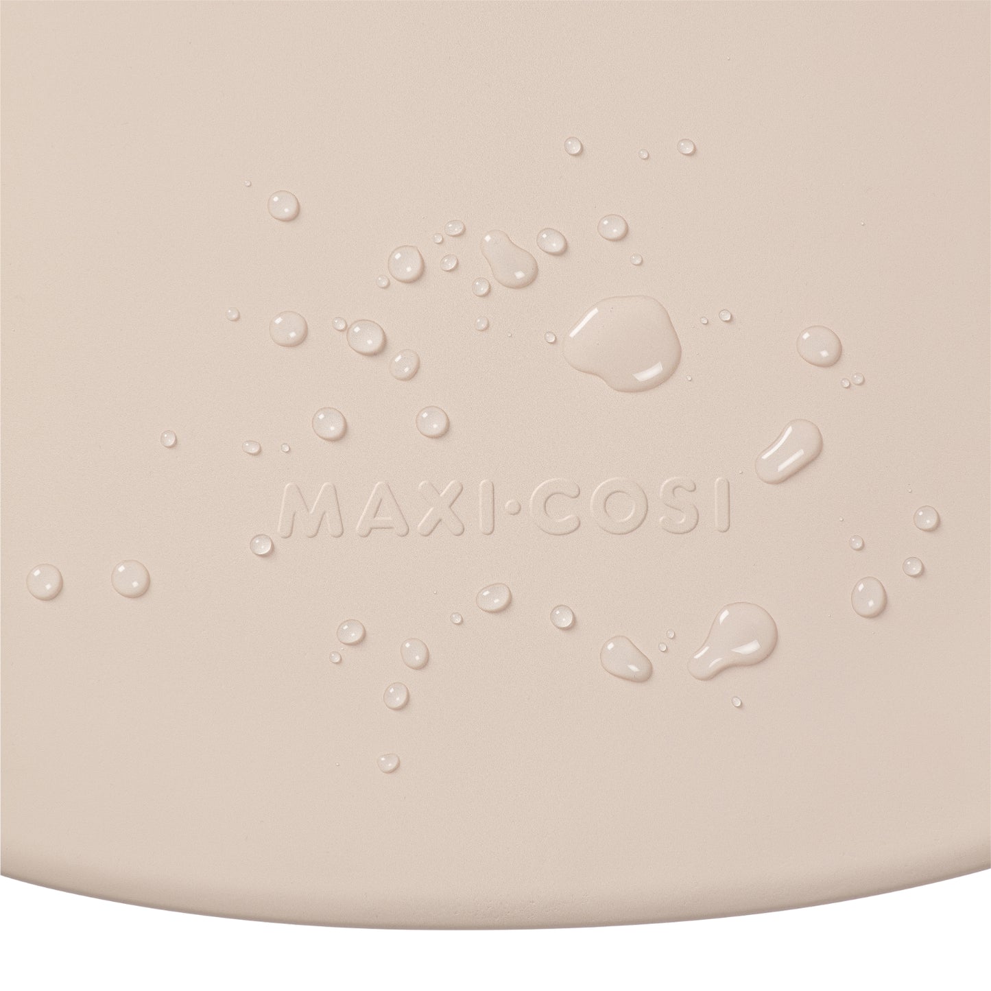 Cambiador beige de MAXI COSI con textura y gotas de agua visible