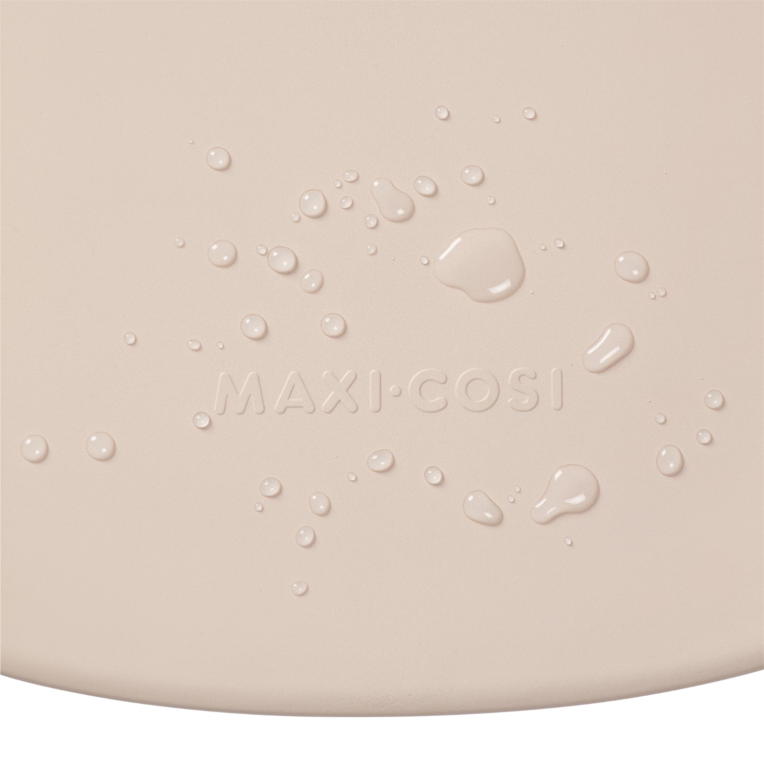 Cambiador beige de MAXI COSI con textura y gotas de agua visible