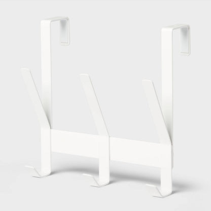 Perchero blanco de metal frontal, ideal para organizar espacios en el hogar
