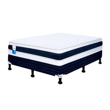 almohada blanca y azul sobre base de colchón en dormitorio
