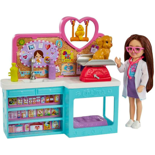 Juego de veterinaria MATTEL con muñeca, mesa de examen y cachorro en una consulta veterinaria.