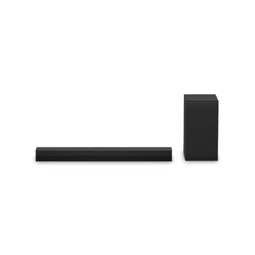 Barra de sonido negra LG con subwoofer, vista lateral en ambiente moderno