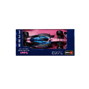 Carro de carrera Maisto rosa y azul visto desde arriba en caja