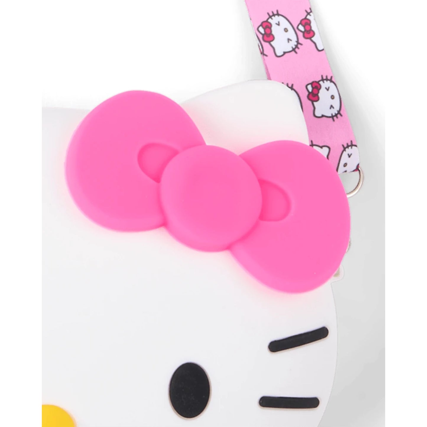 Cartera de Hello Kitty con lazo rosa y detalles en forma de cara, vista frontal