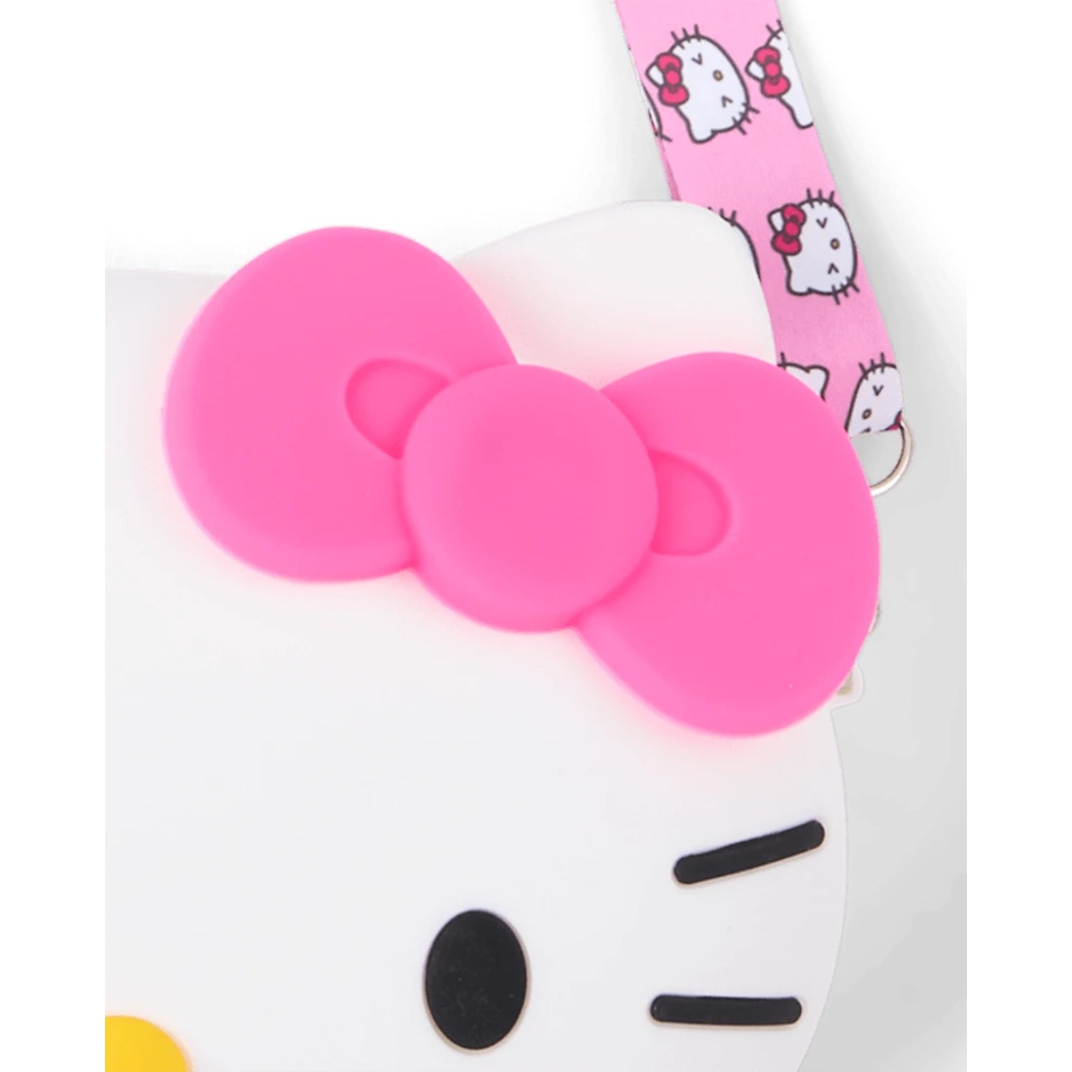 Cartera de Hello Kitty con lazo rosa y detalles en forma de cara, vista frontal