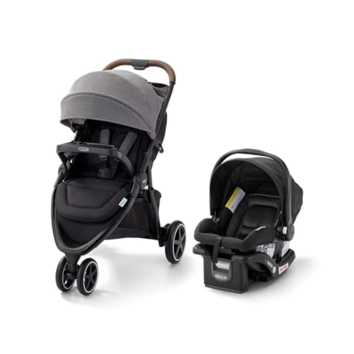 Coche de bebé Graco gris, vista frontal con asiento de seguridad incluido