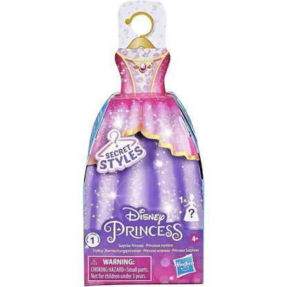 Muñeca princesas Disney con vestido morado, vista frontal en caja sorpresa