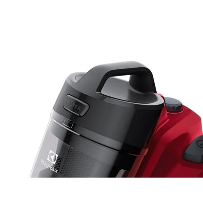 Aspiradora Electrolux roja, vista superior del depósito de polvo en uso