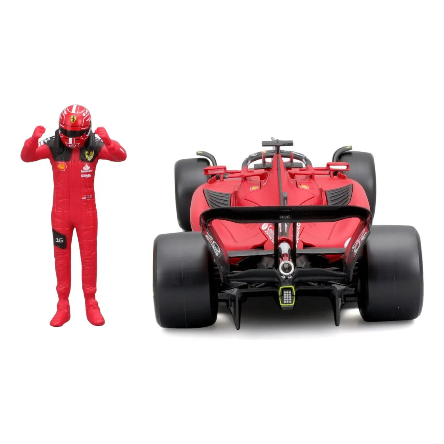 Modelo de coche Ferrari rojo con figura de piloto celebrando, detalle trasero.