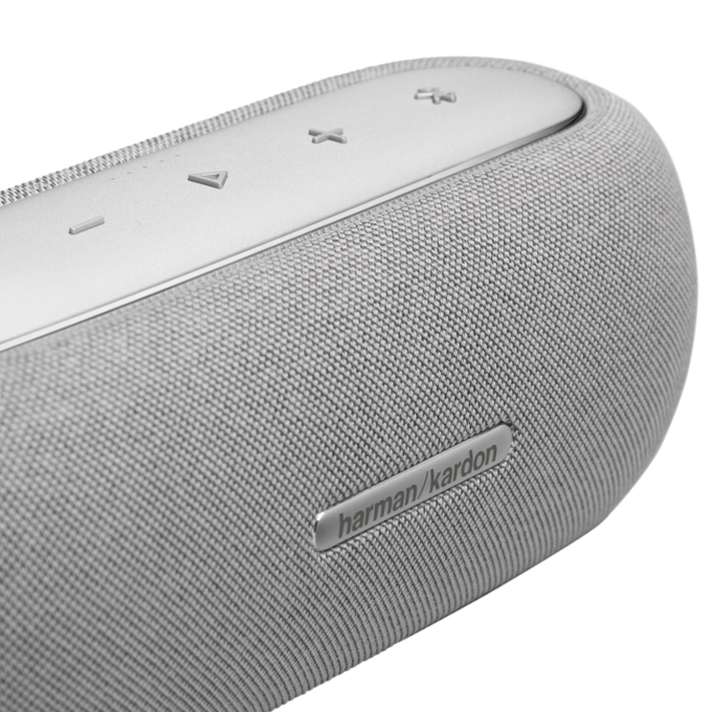Parlante gris Harman Kardon vista lateral con controles de reproducción