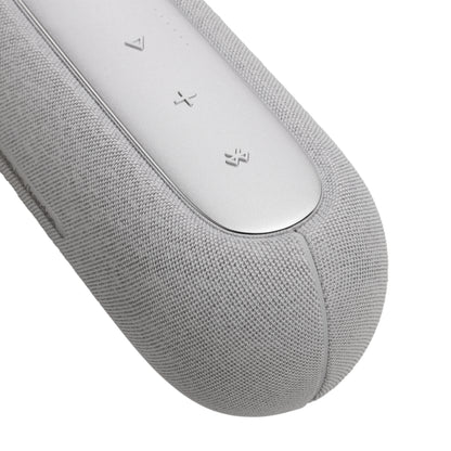 Parlante HARMAN KARDON gris vista lateral, botones de control superiores