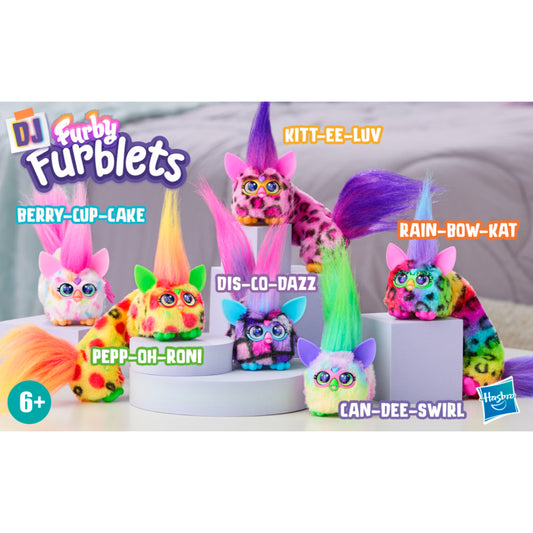 Juguetes Furby Furblets de colores brillantes en exhibición con diferentes expresiones