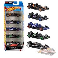 Set de coches de carrera Hot Wheels F1 en varios colores, vista frontal con caja