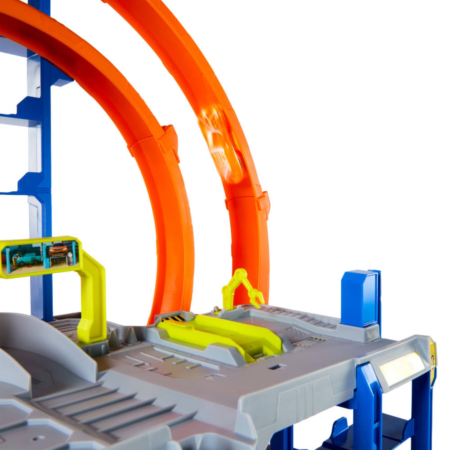 Juego de pista Hot Wheels naranja y azul, vista superior con loop y lanzador