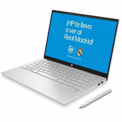 Laptop HP blanca vista lateral con pantalla que promociona el Real Madrid