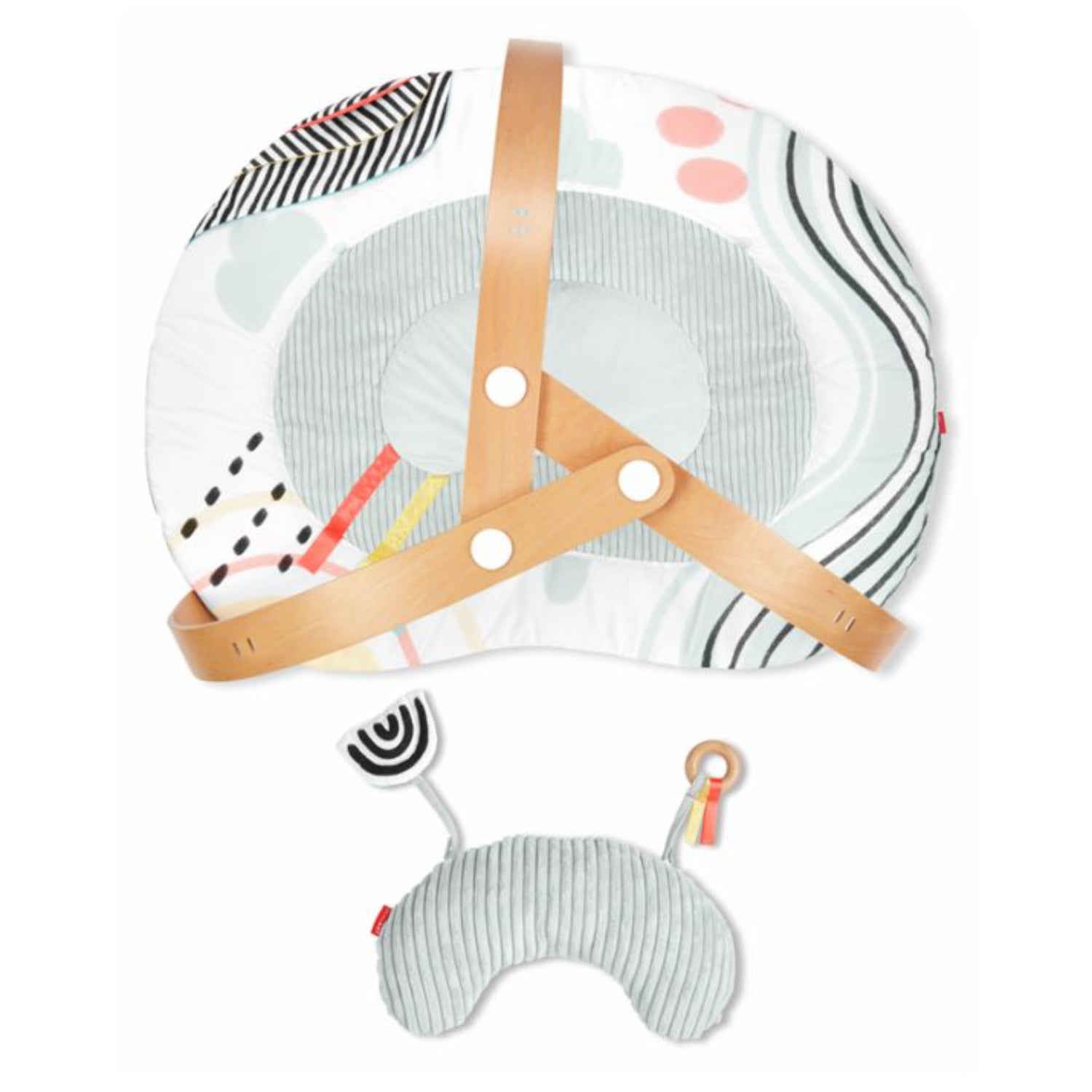 Colchón SKIP*HOP en colores suaves, vista frontal con almohada de soporte