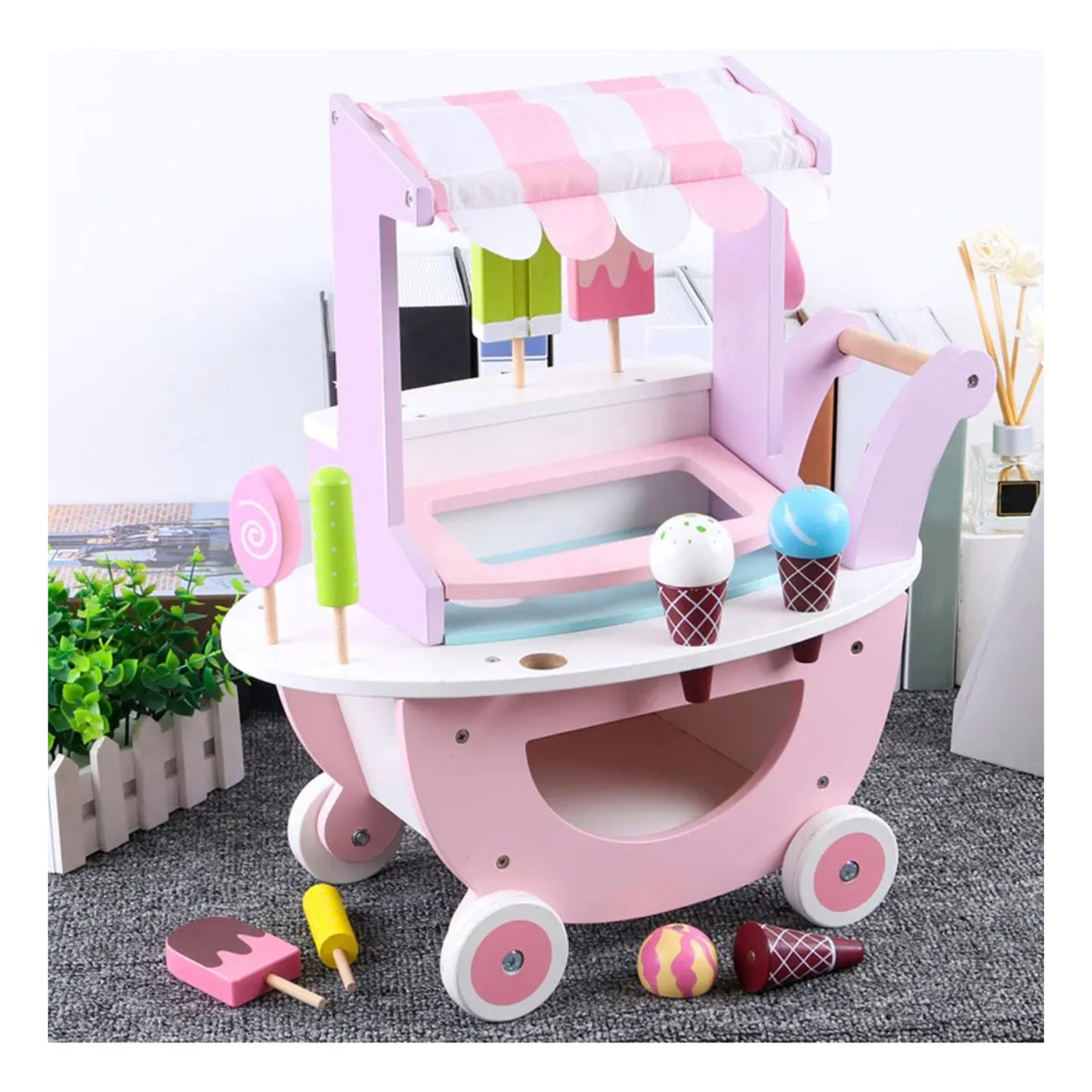 Carrito de helados de madera rosa con bolas de helado y paletas, vista frontal