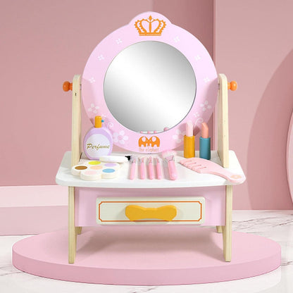 Espejo de tocador rosa con maquillaje y accesorios, habitación infantil
