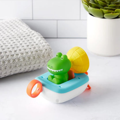 Barco de juguete con cocodrilo verde, decorado con piña, ideal para baño