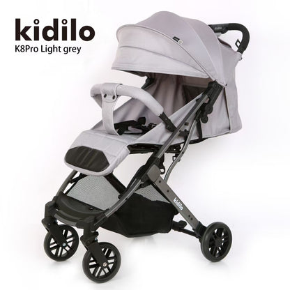Coche gris claro KIDILO K8Pro, vista lateral, ideal para paseos con bebés