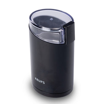 Molino de café eléctrico IMUSA en color negro con tapa transparente y diseño compacto