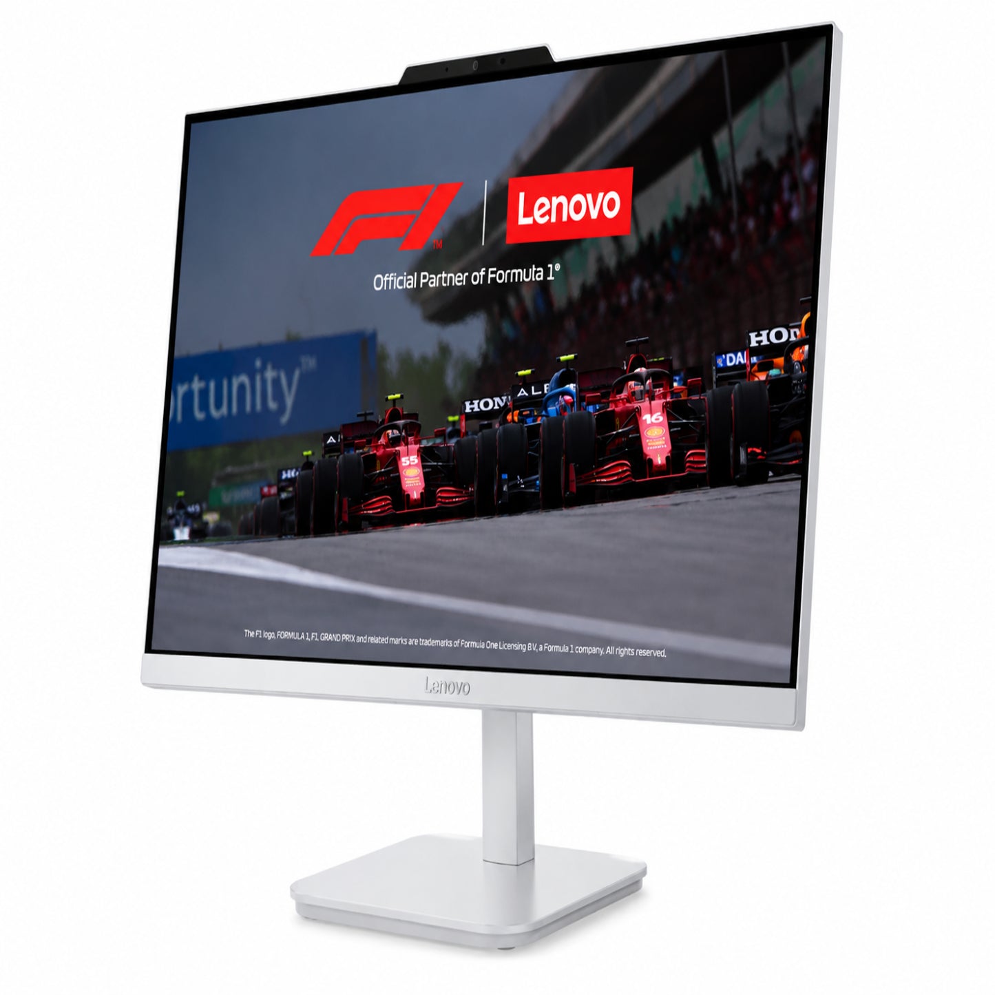 Escritorio Lenovo blanco, monitor frontal con fondo de carreras de Fórmula 1