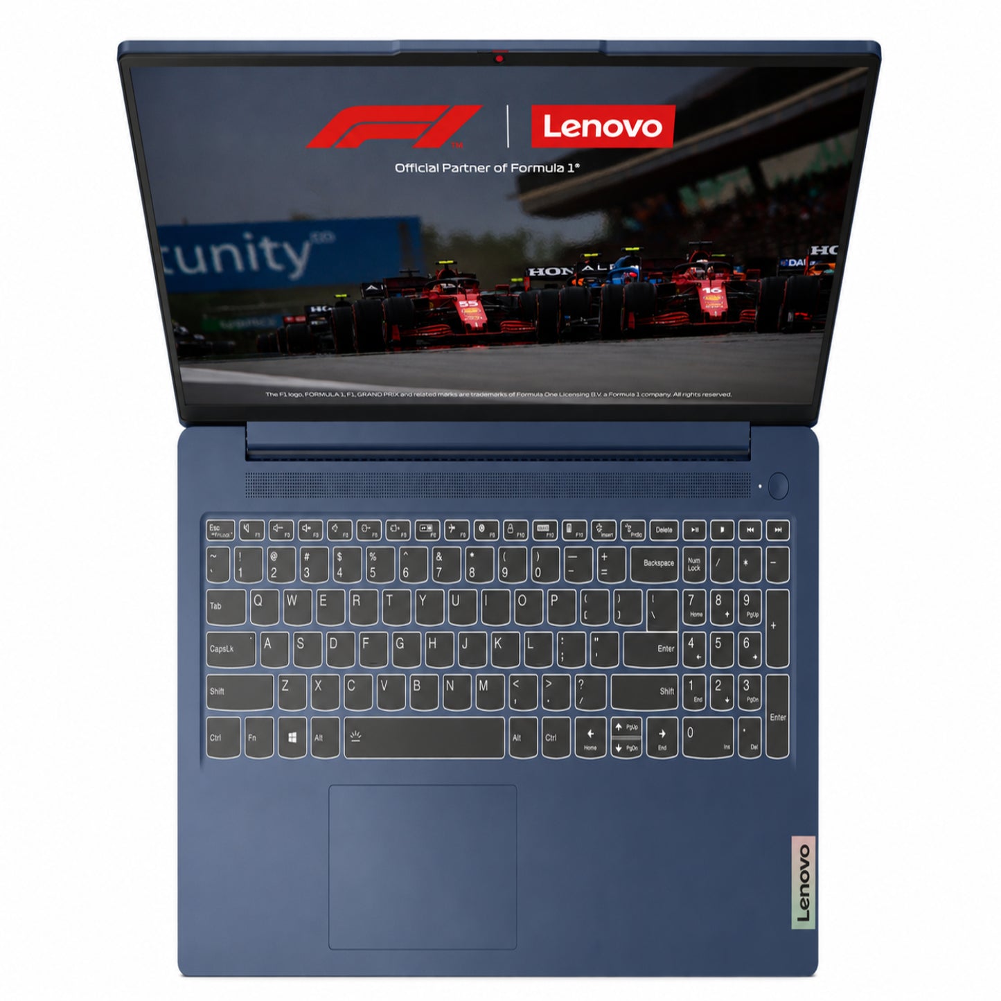 Laptop Lenovo azul vista superior con fondo de Fórmula 1 y teclado iluminado