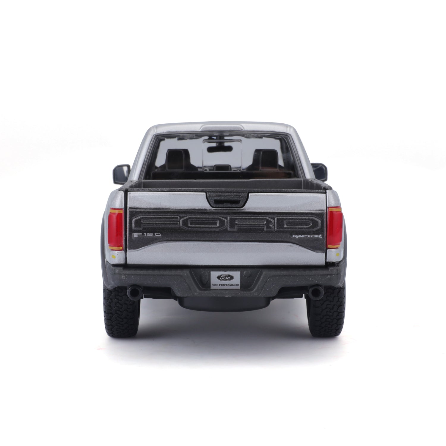 Carro Ford Raptor gris visto desde atrás