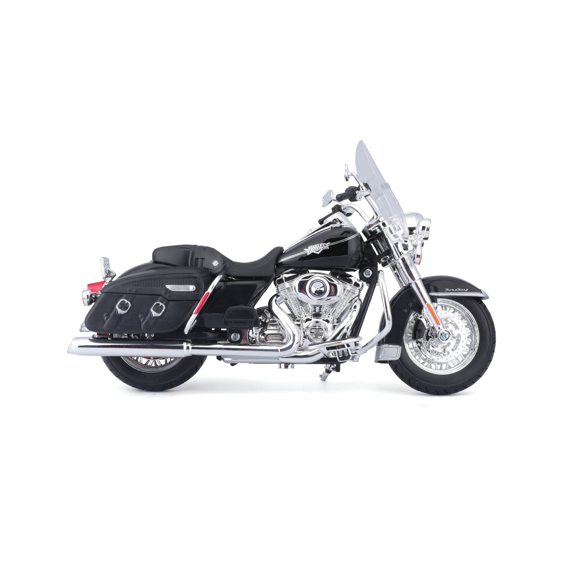 Moto negra Maisto vista lateral, detalles cromados y maletas laterales