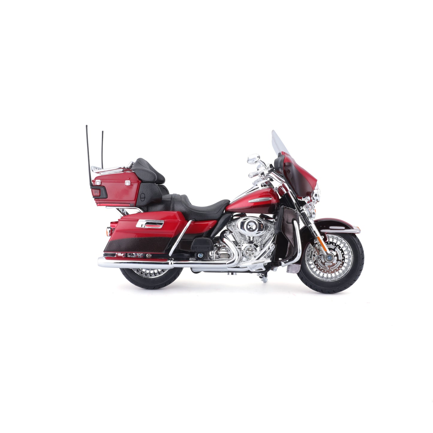 Motocicleta roja MAISTO lateral, modelo detallado con accesorios en miniatura