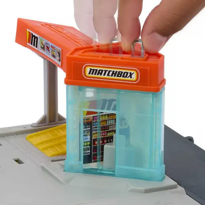 Tienda Matchbox naranja y azul con detalles interiores, juego de juguetes para niños