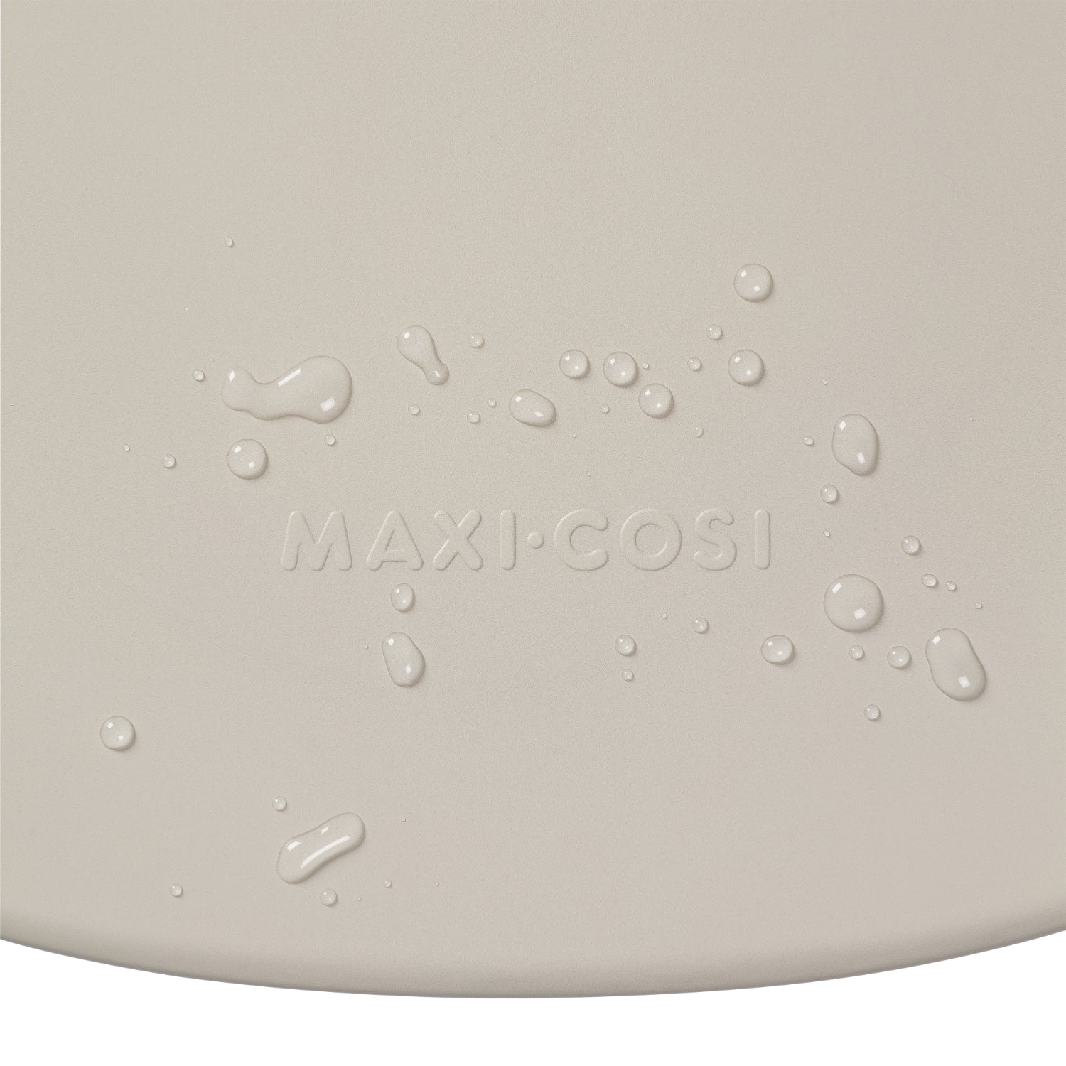 Cambiador beige de MAXI COSI, vista detallada con gotas de agua