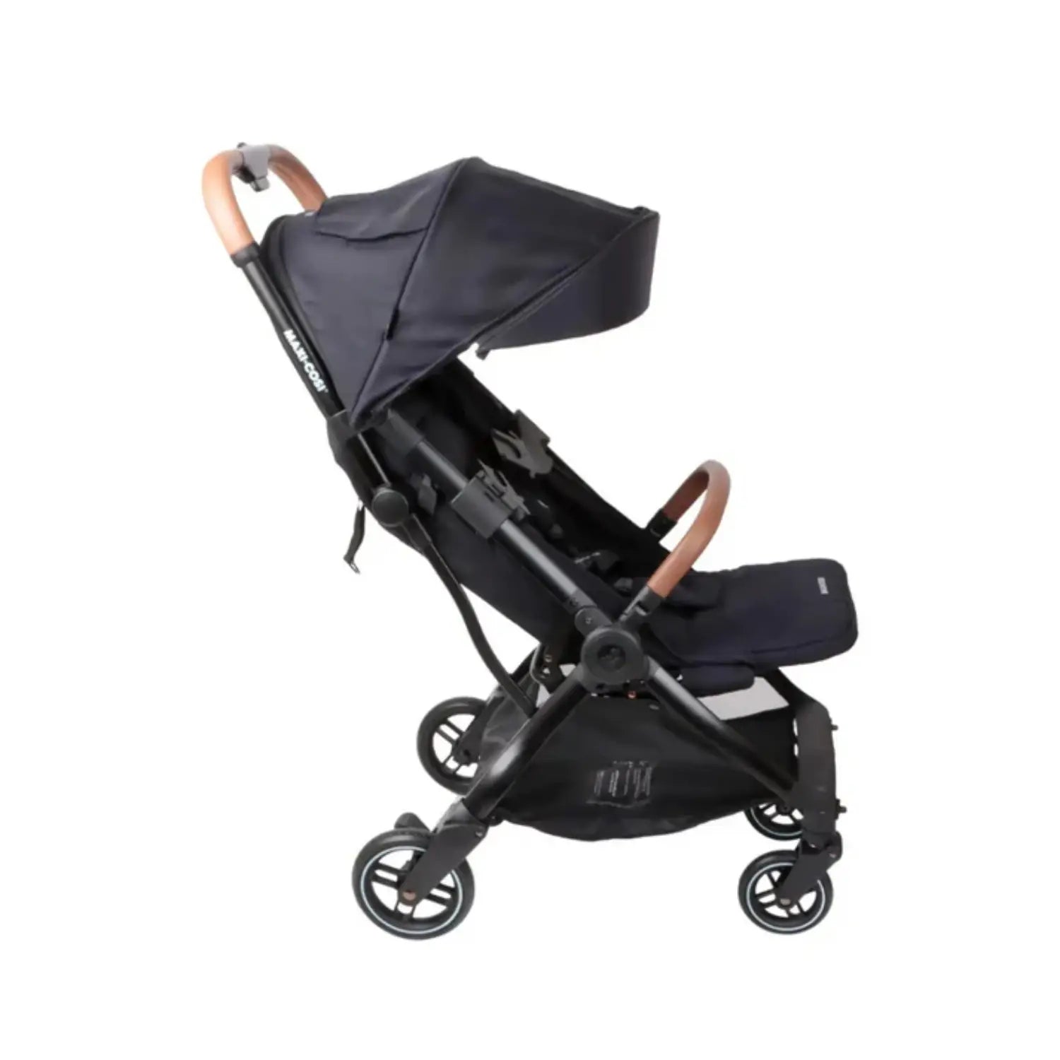 Coche Maxi Cosi negro lateral, diseño elegante y práctico para paseos