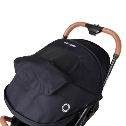 Coche MAXI COSI negro vista superior, ideal para paseos cómodos
