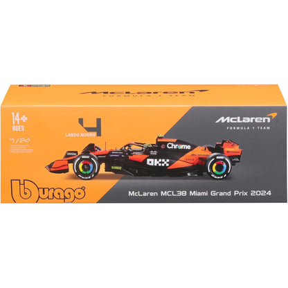 Modelo de auto McLaren MCL38, vista lateral, color naranja y negro, colección de Maisto