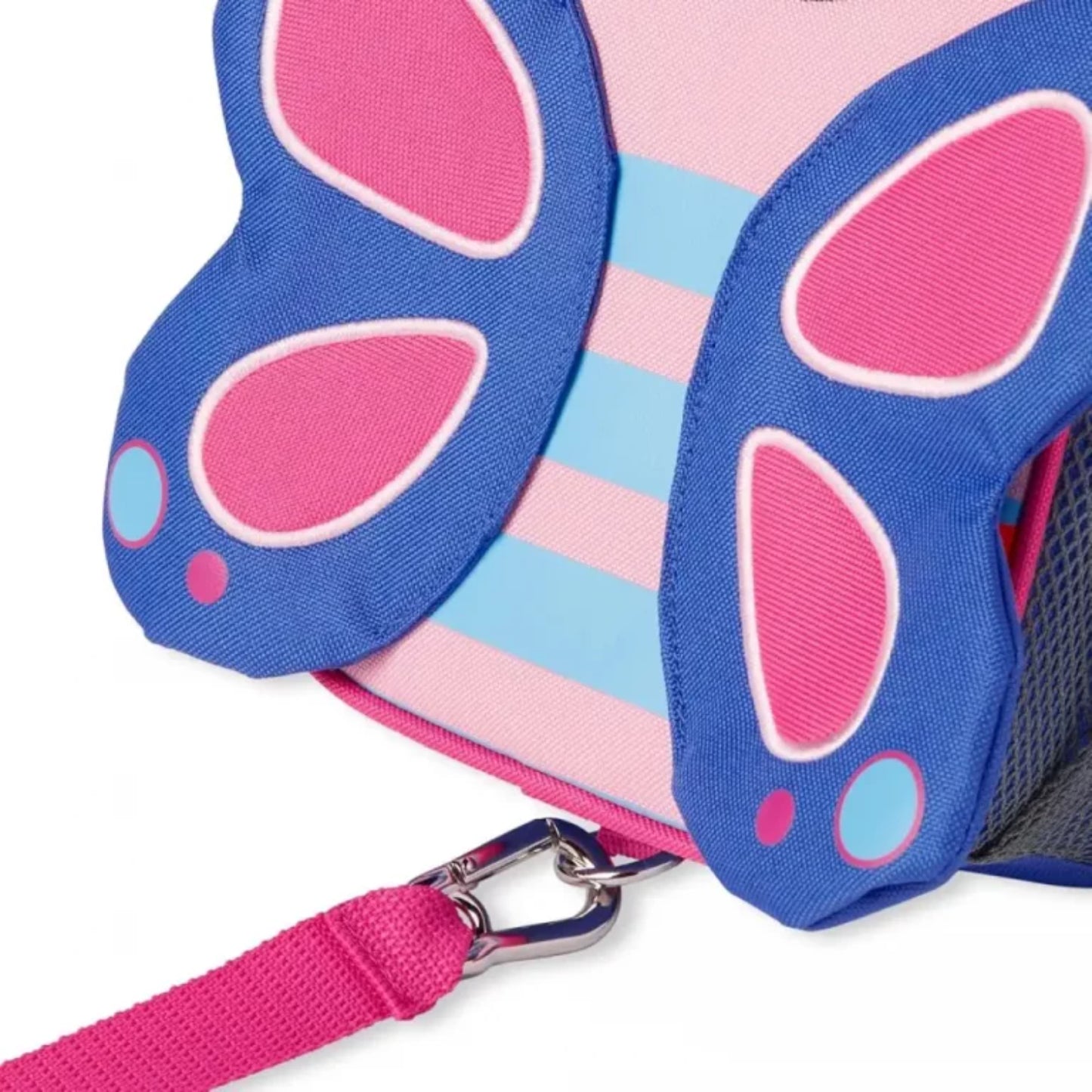 mochila infantil azul con detalles en rosa, vista lateral, adecuada para el uso diario