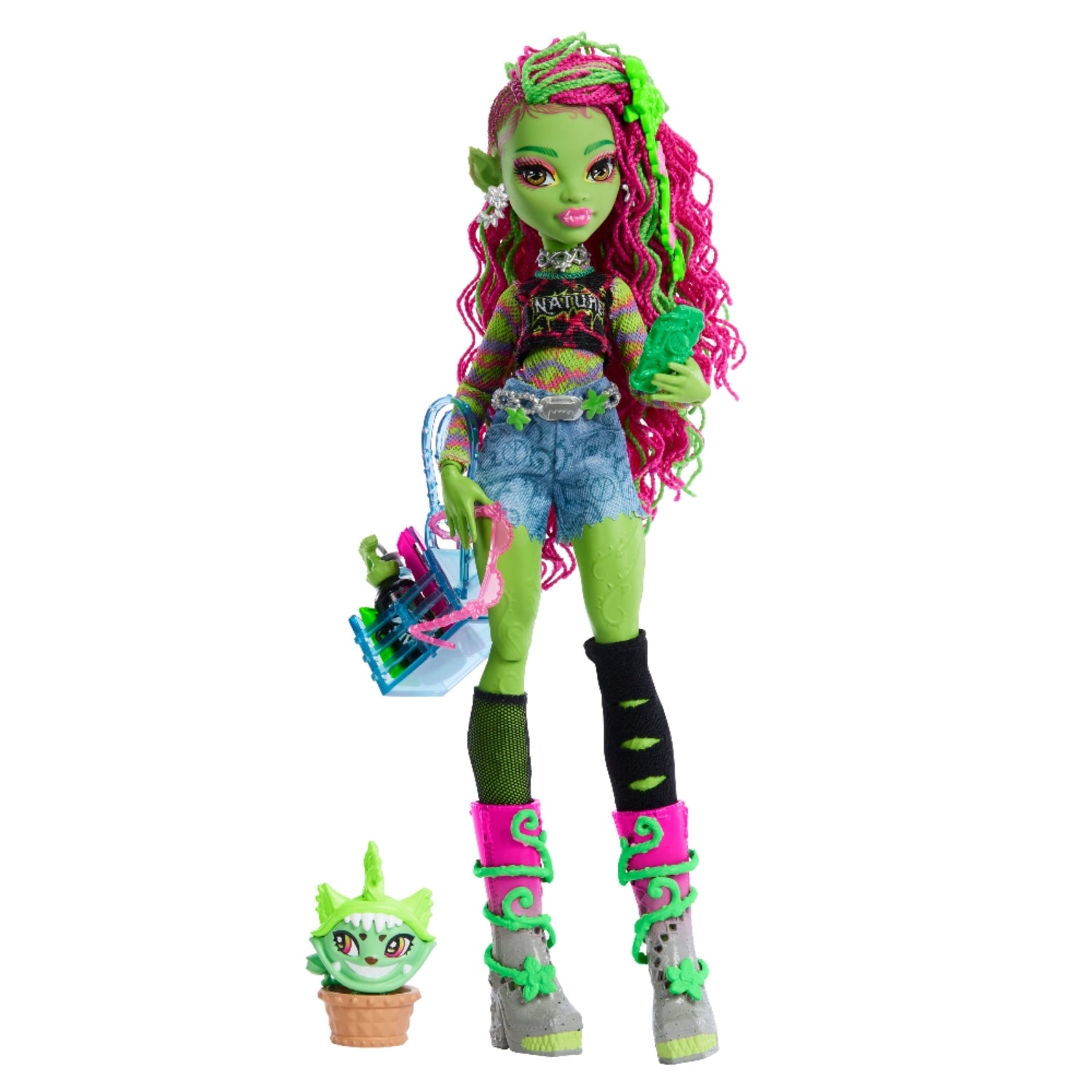 Muñeca Monster High verde con cabello rosa, ropa moderna y accesorios divertidos