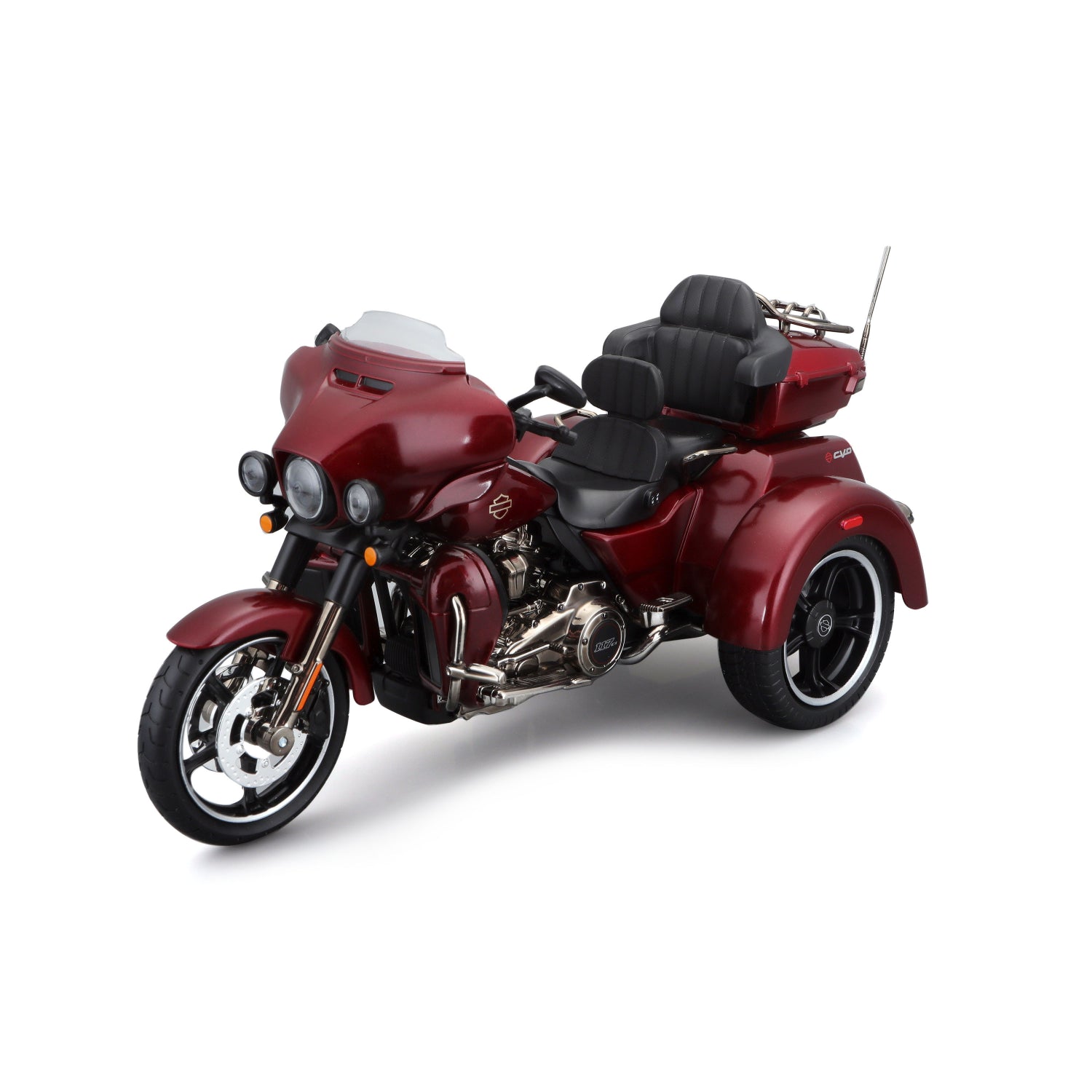 Motocicleta de tres ruedas roja con detalles negros, vista lateral