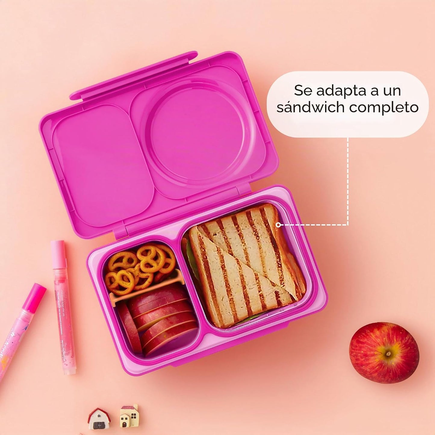 Lonchera rosa OMIE LIFE abierta con sándwich y snacks