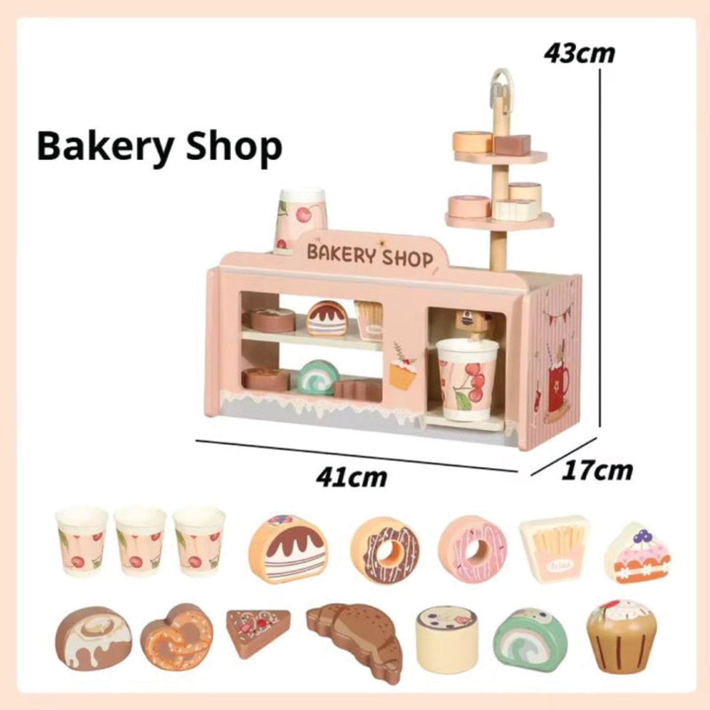 Juguete de panadería rosa con tarta, cupcakes y tazas en un escaparate