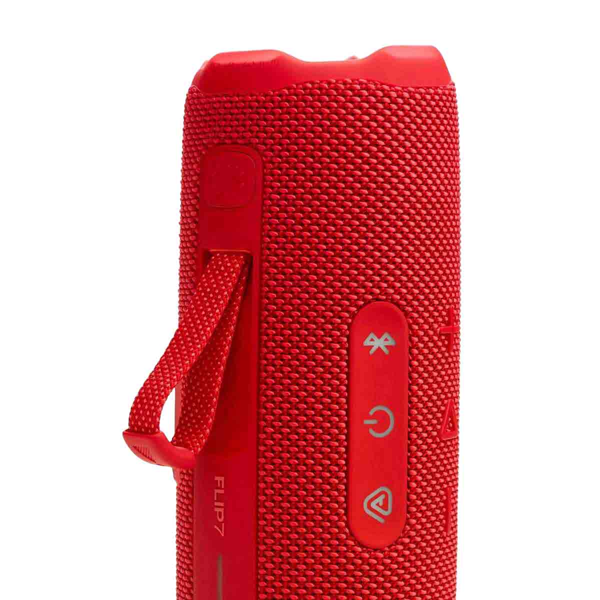 Parlante JBL Flip 7 rojo portátil con botones de control y diseño resistente al agua
