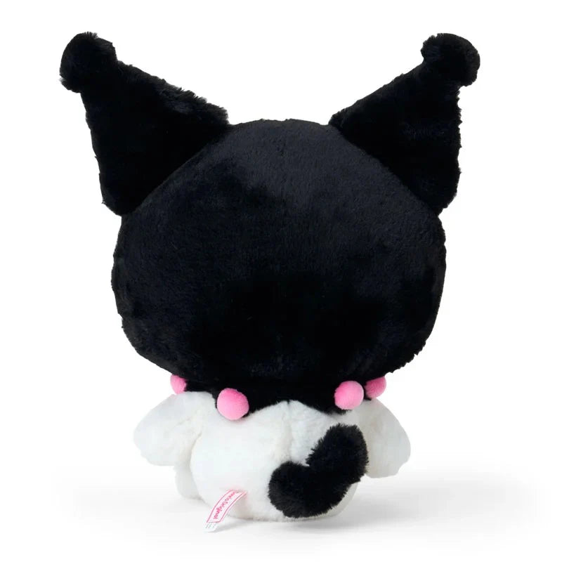 Peluche negro de Sanrio visto desde atrás, suave y adorable.