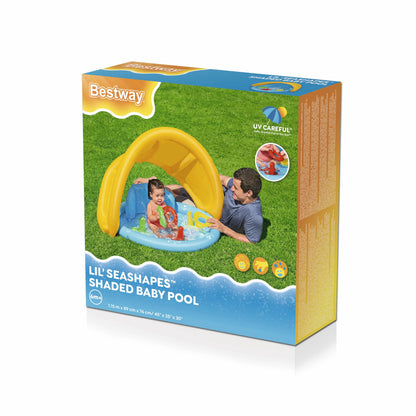 Piscina infantil con accesorios amarilla y azul, vista frontal en jardín