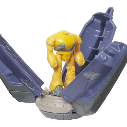 Juguete de cíclope amarillo en acción, vista frontal de la figura y su base