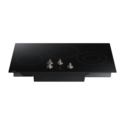 Placa vitrocerámica eléctrica 4 quemadores Samsung con diseño negro y controles metálicos frontales