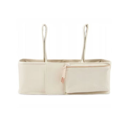 Organizador de cuna beige con compartimento, perfecto para bebés
